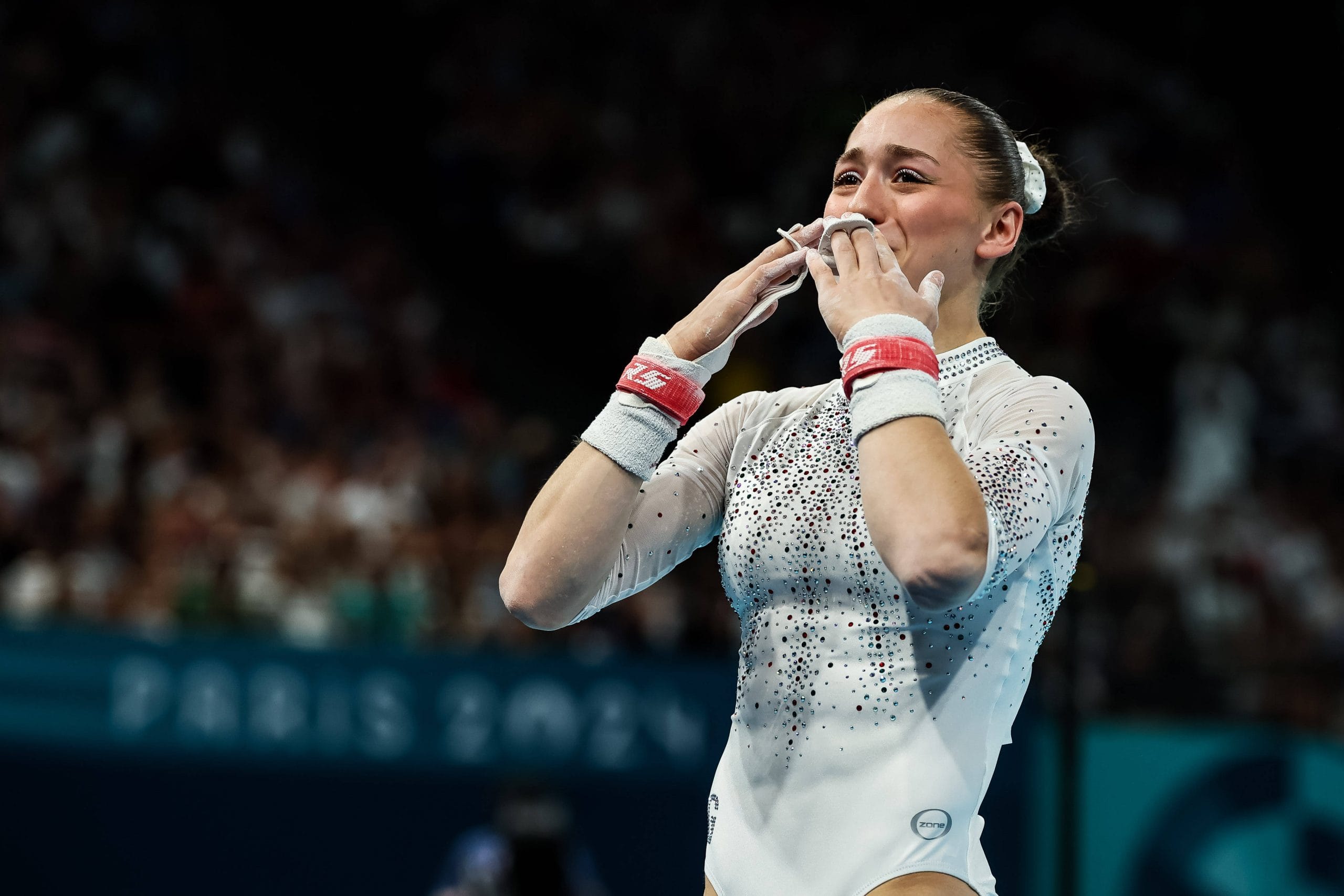 Kaylia training on uneven bars
